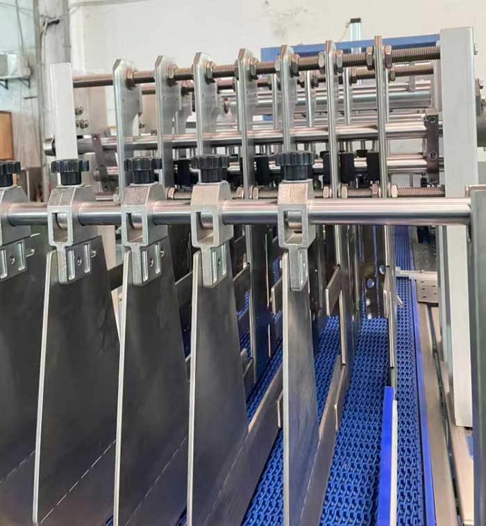 Bottle divider adjustment button of linear shrink packing machine